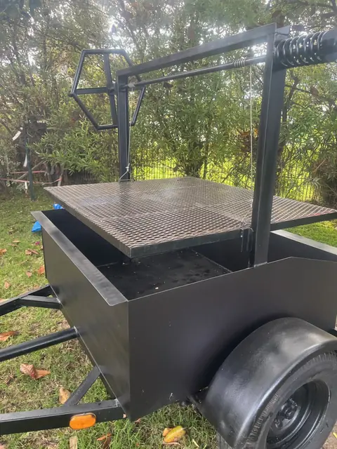The heavy steel grate of the Oak & Ember grill